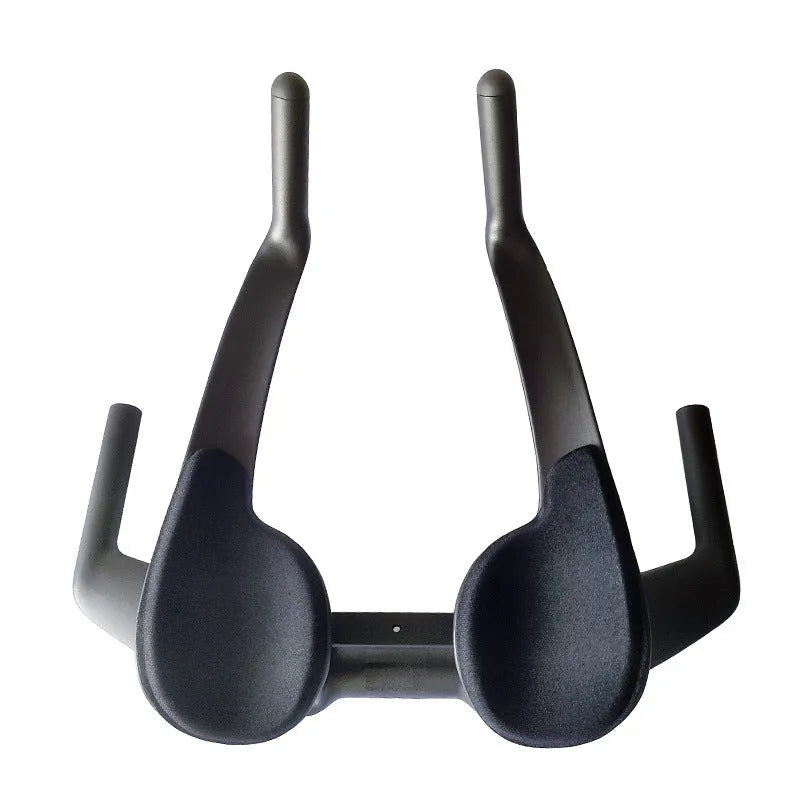 Black carbon fibre TT bicycle handlebars showing angled extensions and clamp area.