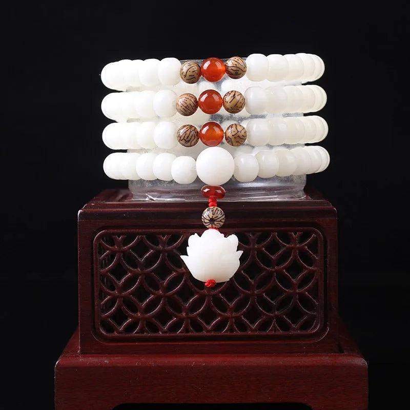 White jade Bodhi seed bracelet with 6x8mm beads showing multiple decorative style options