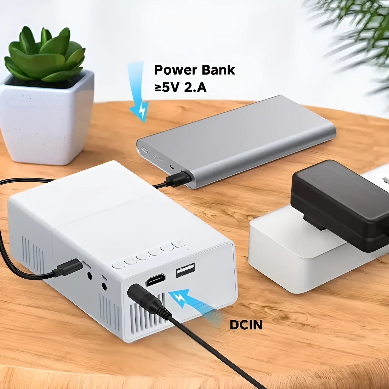 White or black M100 Mini Portable LED Projector displaying a large screen image.