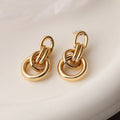 Geometric copper earrings with gold colour finish in irregular shape