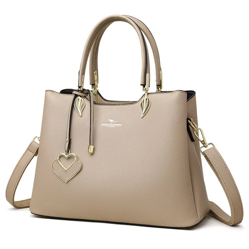 Women's black PU leather shoulder messenger bag with multi-layer compartments and visible stitching details