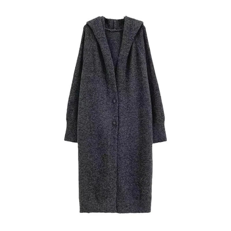 Long grey hooded knitted cardigan on a hanger showing its below-the-knee length and loose fit.