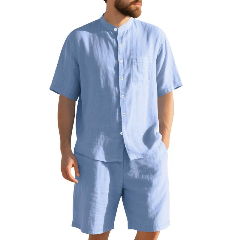 Men's light blue linen blend summer suit with henry collar, short sleeves, and matching shorts