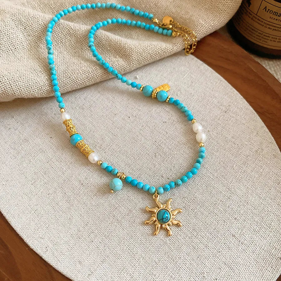 Stone freshwater pearl sun necklace with French royal style pendant on adjustable clavicle chain