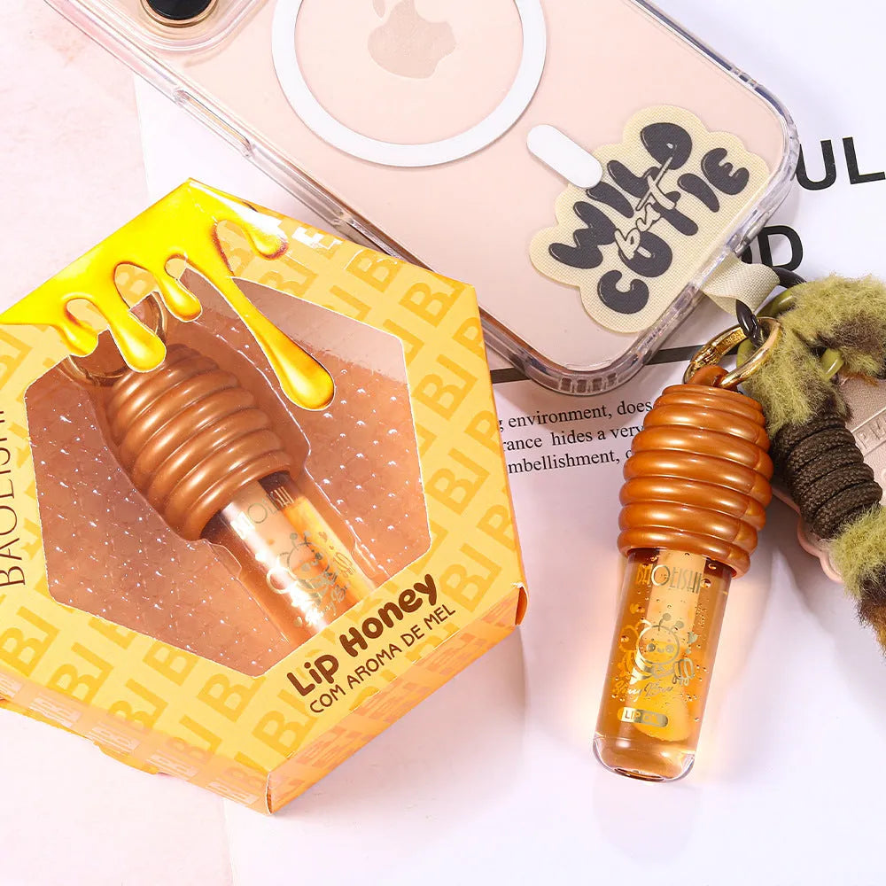 Honey lip gloss attached to keychain with pannier bag connector