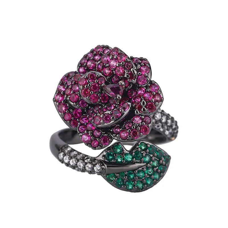 Black gold plated geometric floral ring with a red simulated corundum stone for women.