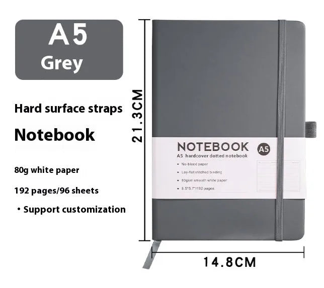 A5 soft touch PU leather diary notebook with strap closure, open to show lined white paper pages