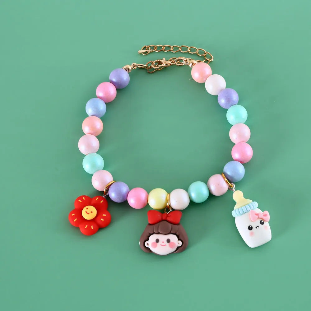 Colourful resin pet jewellery with moon and meteor motifs in macaron colours for dogs and cats