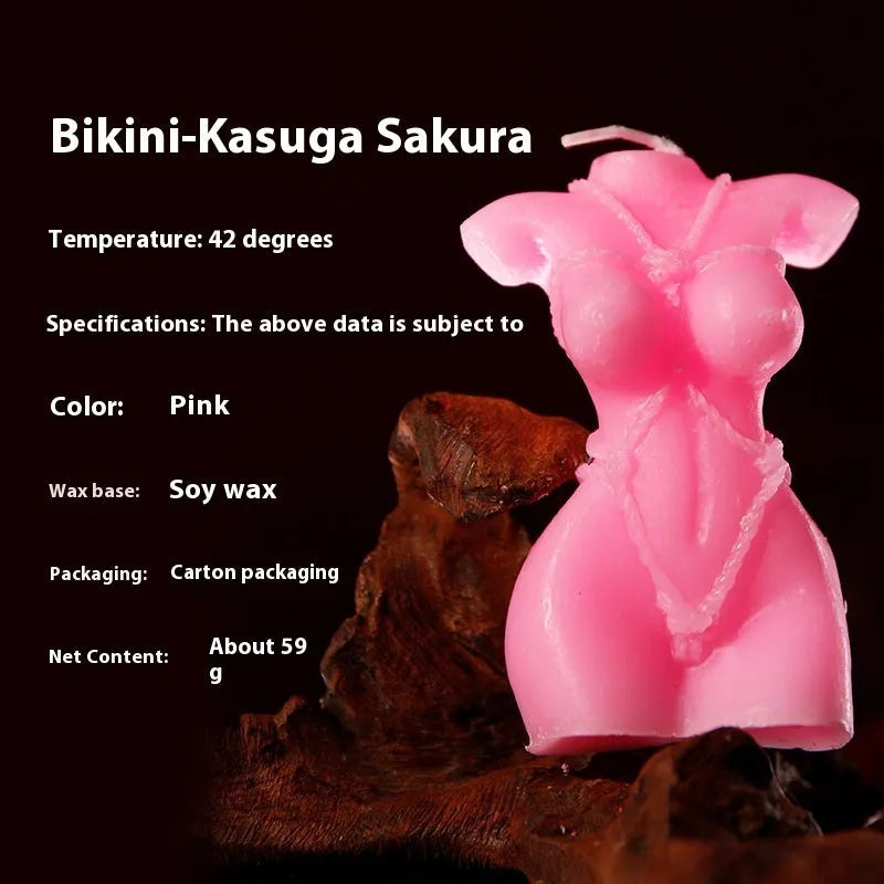 Smsexy Props soy wax bikini-shaped fragrance candle in red, pink, or purple.