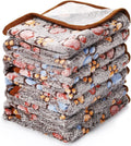 Soft coral fleece dog blanket with a paw print design, shown in a beige colour.
