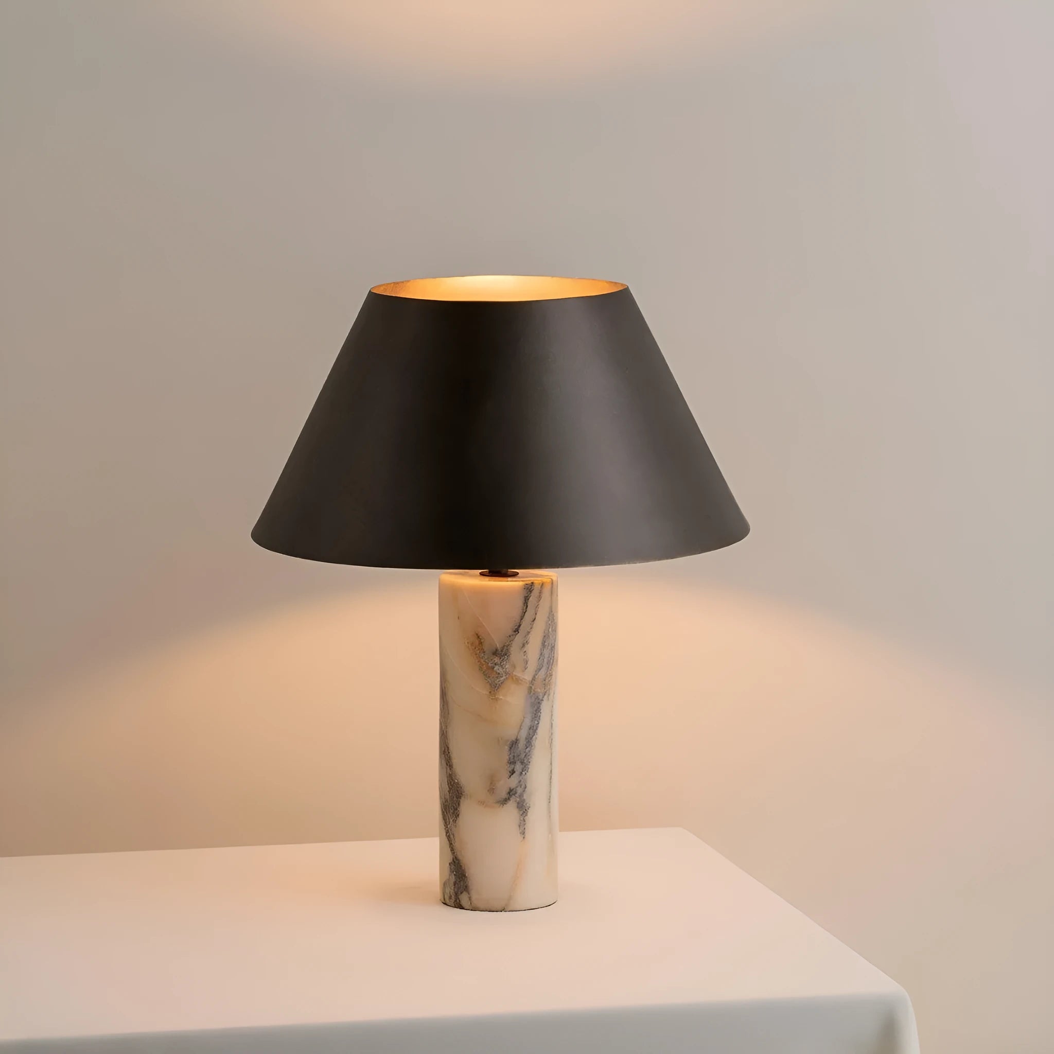 Black marble table lamp with modern simple design on wooden surface