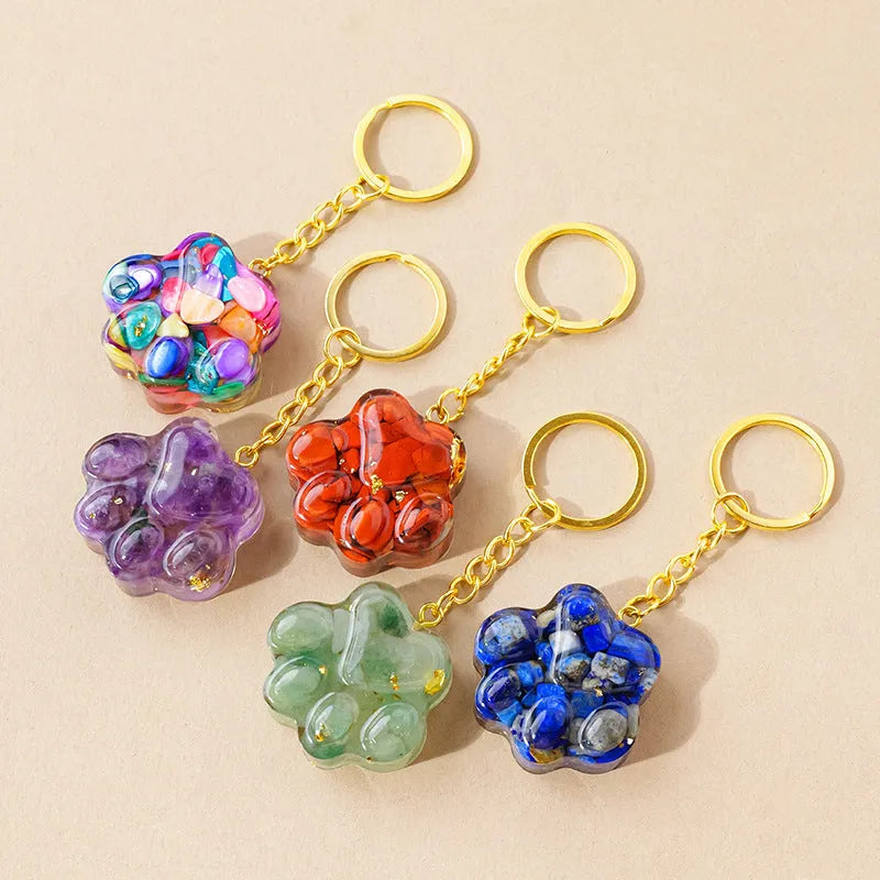Small natural crystal cat's paw shaped pendant on a metal keyring, available in various crystal colours.
