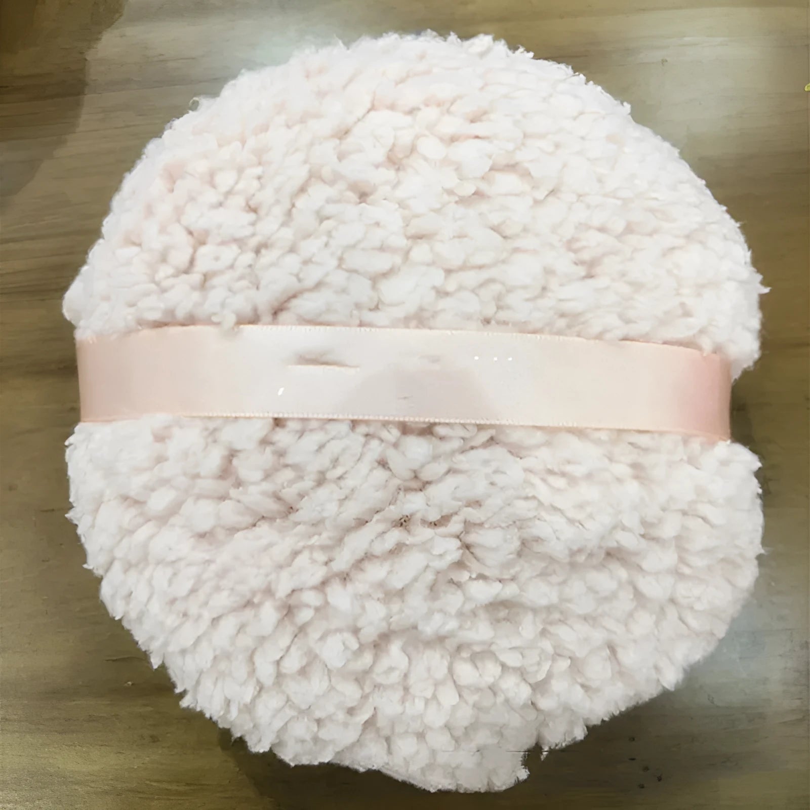 Oversized rectangular plush powder puff measuring 150x75mm in white colour