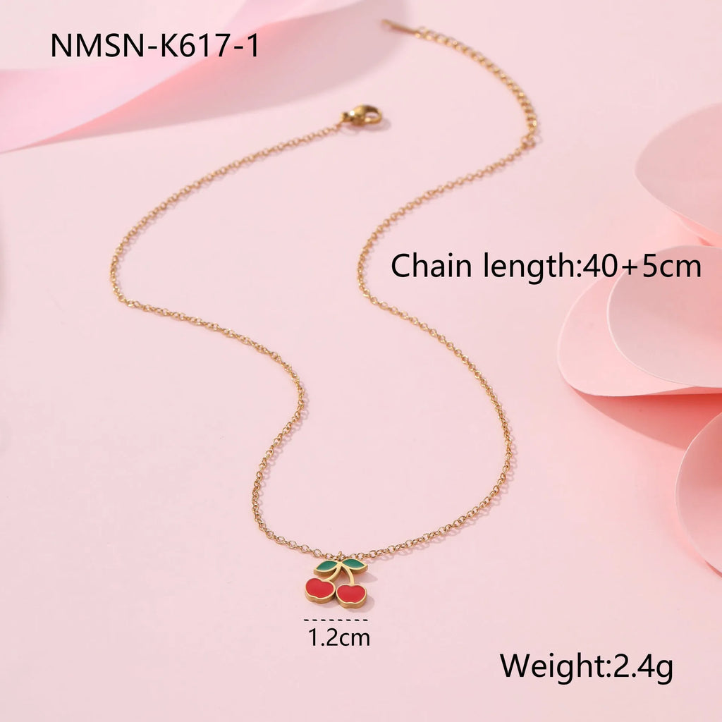 Cherry shaped jewellery set with necklace, bracelet, earrings, and ring in gold-plated stainless steel