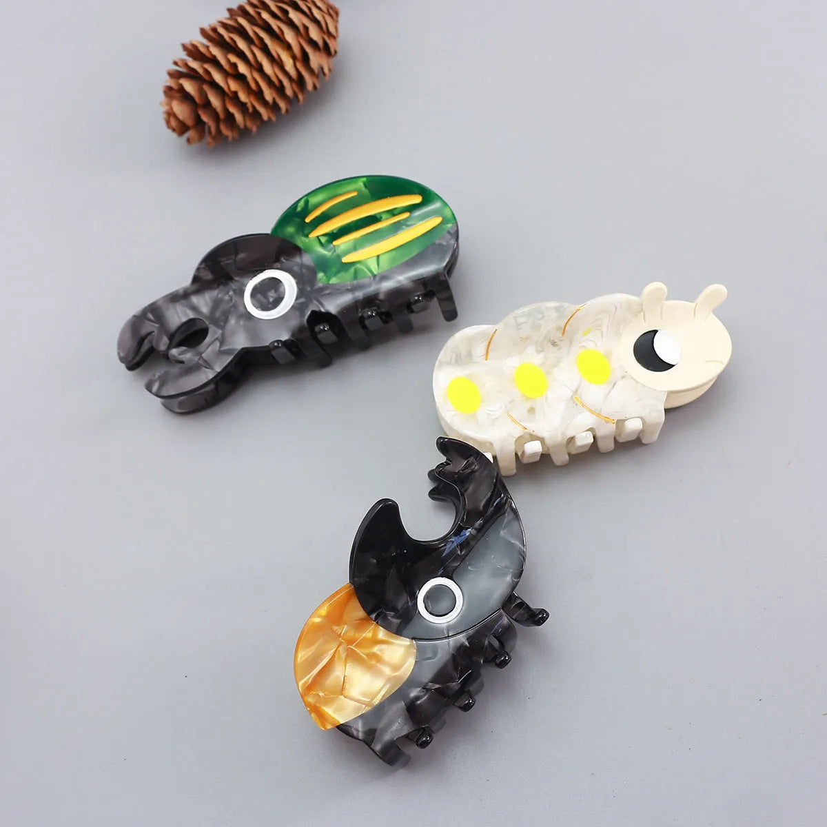 Cartoon-style beetle grip insect biology collectable on cellulose acetate sheet