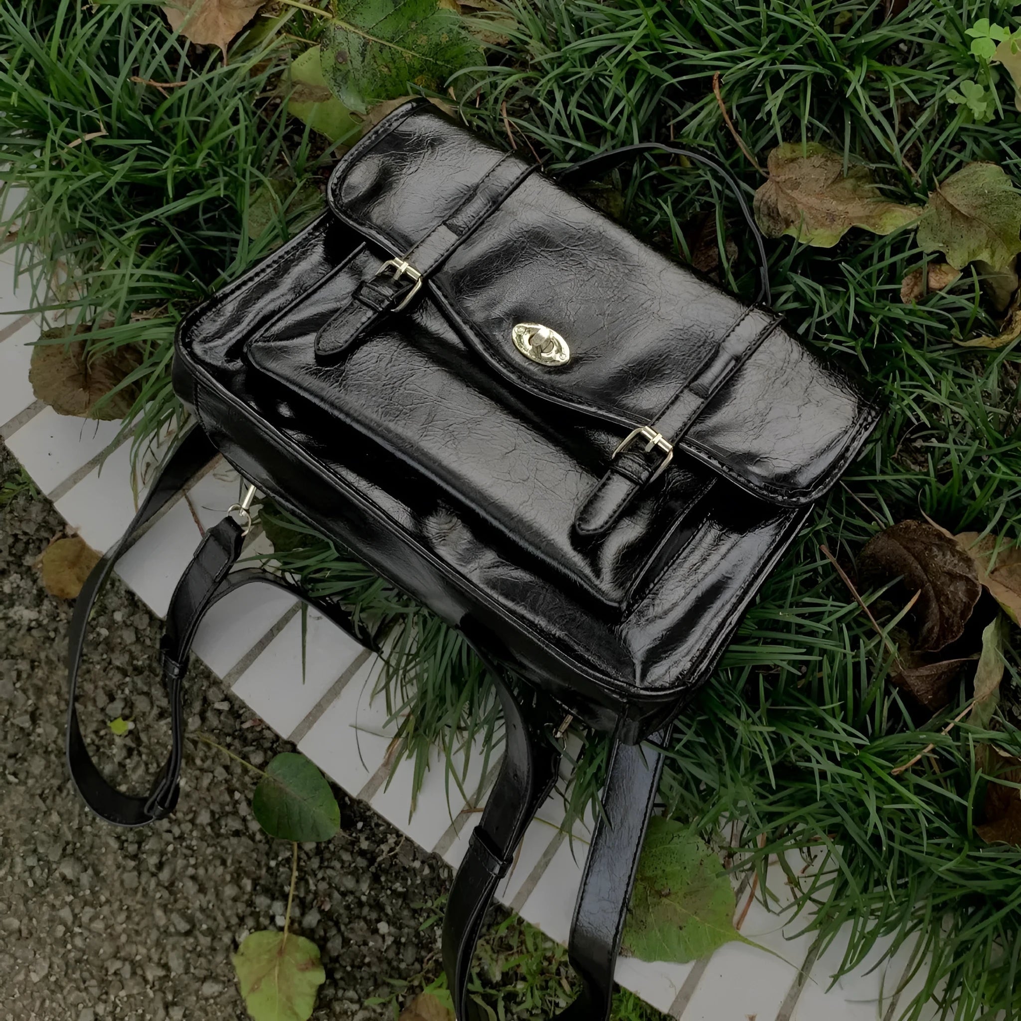 Black college style messenger bag with oil wax leather-look finish showing 35cm length dimensions