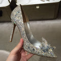 Women's gold pointed toe high heels with rhinestone detail and stiletto heel