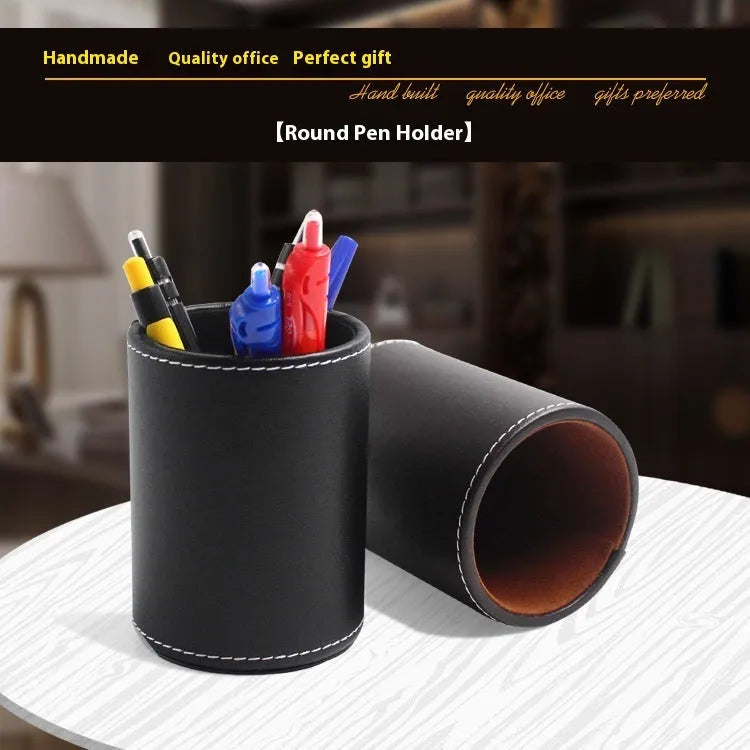 Round black leather pen holder with 8.0cm diameter on a desk