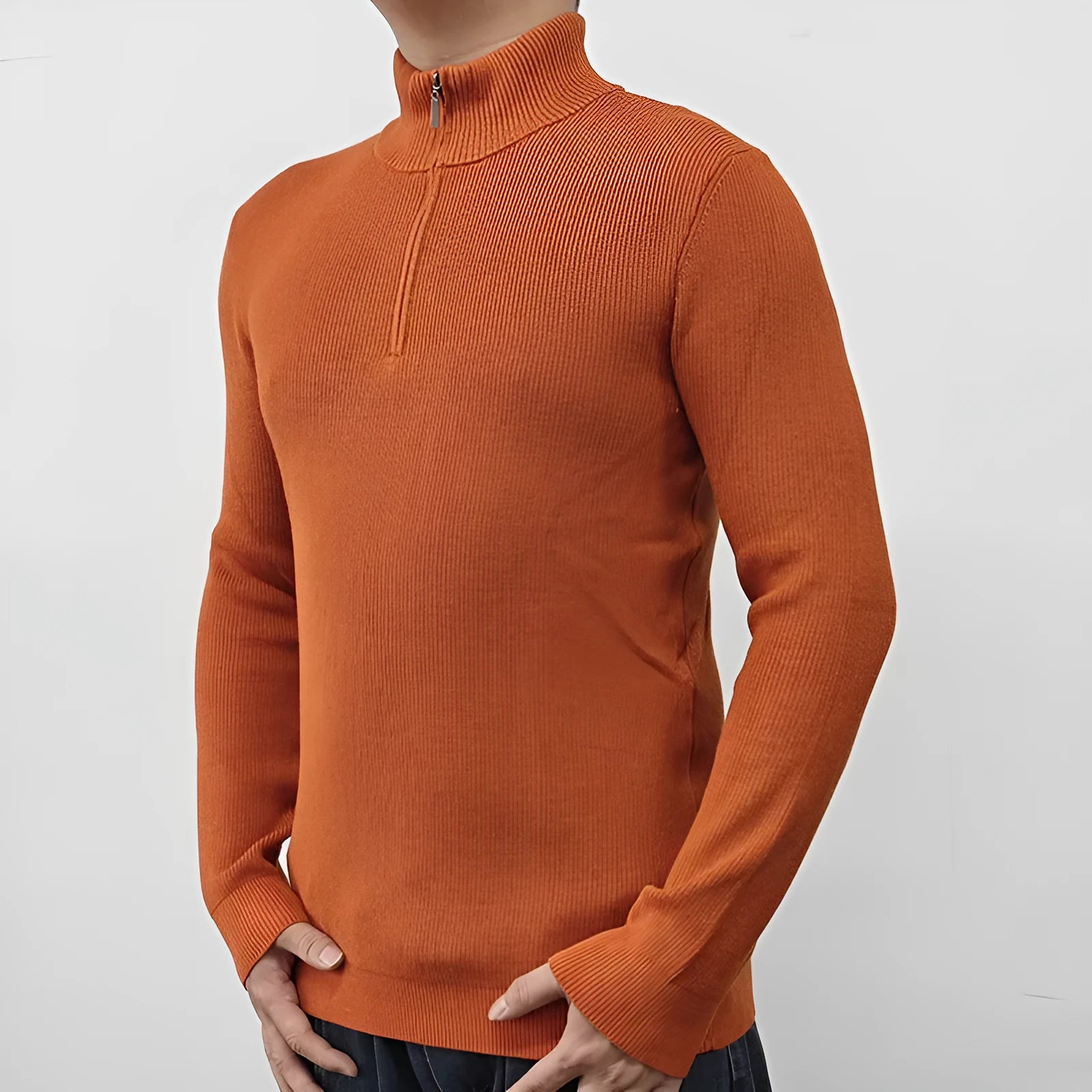 Man wearing a grey half-turtleneck zipper sweater, a cotton blend pullover for casual wear.