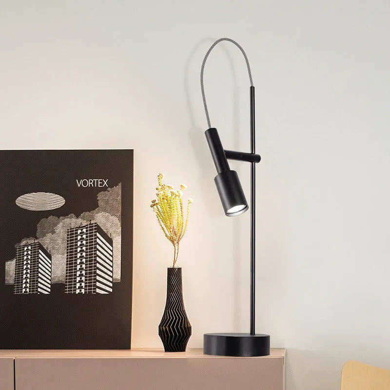 Simple modern rotating table lamp in sand black finish with wrought iron base and G9 bulb, suitable for bedside use