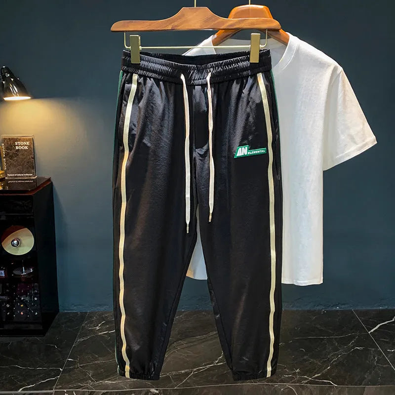 Men's black ice silk cotton harem pants with a relaxed fit and mid-waist.