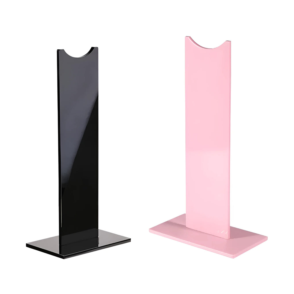 Pink and black detachable gaming headset stand with non-slip silicone base on a desk