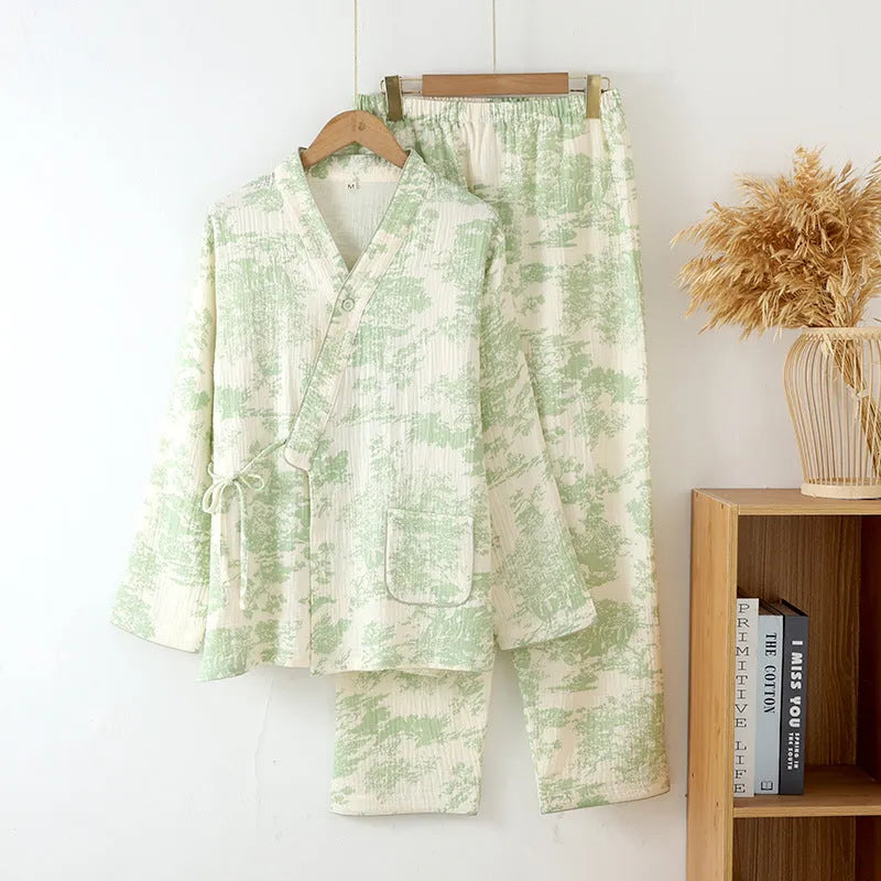 Women's pink pure cotton gauze long sleeve lounge suit top and trousers on a hanger.