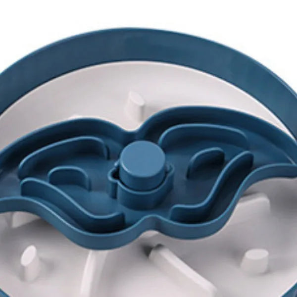 Grey rotating pet slow feeder bowl with a blue silicone windmill-pattern licking mat attached.