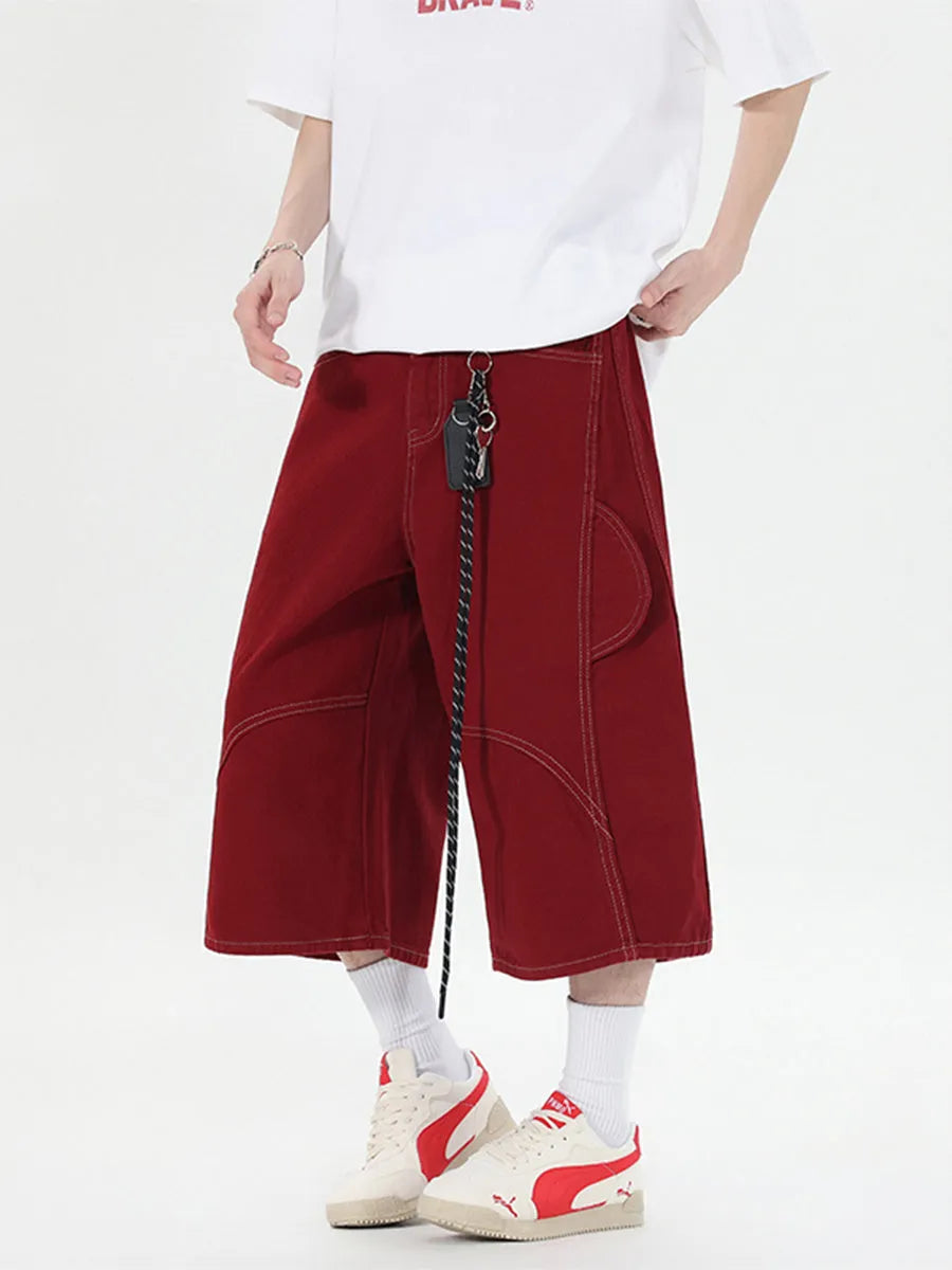 Multi-pocket denim workwear shorts in wide leg cropped style with zipper fly, available in red and black colours