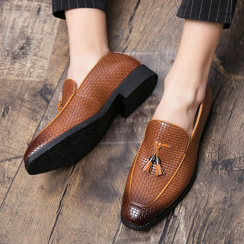 Men's black pointed toe slip-on business shoes with tassel detail on artificial PU leather upper