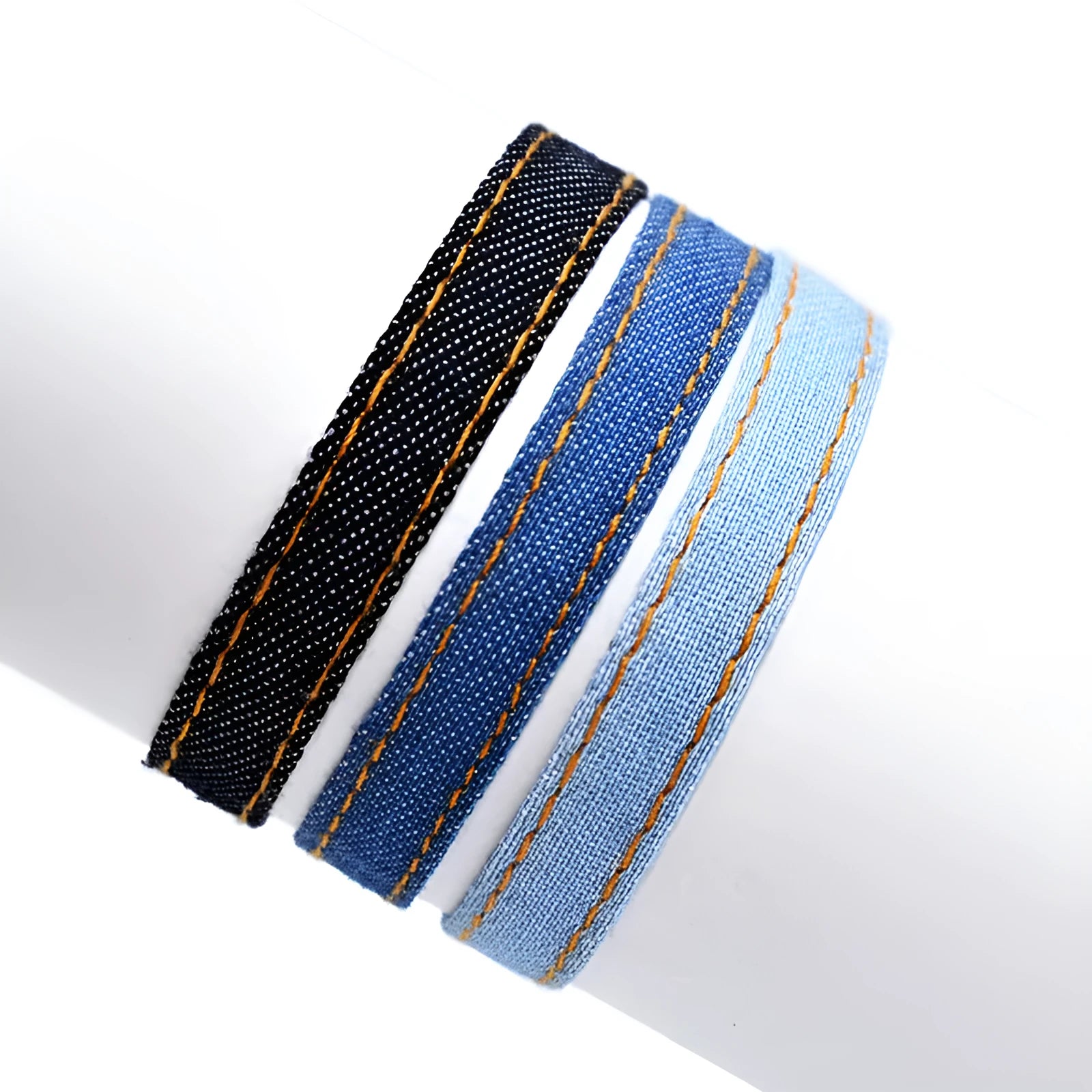 Handmade denim fabric wristband carrying strap in mixed materials with adjustable closure