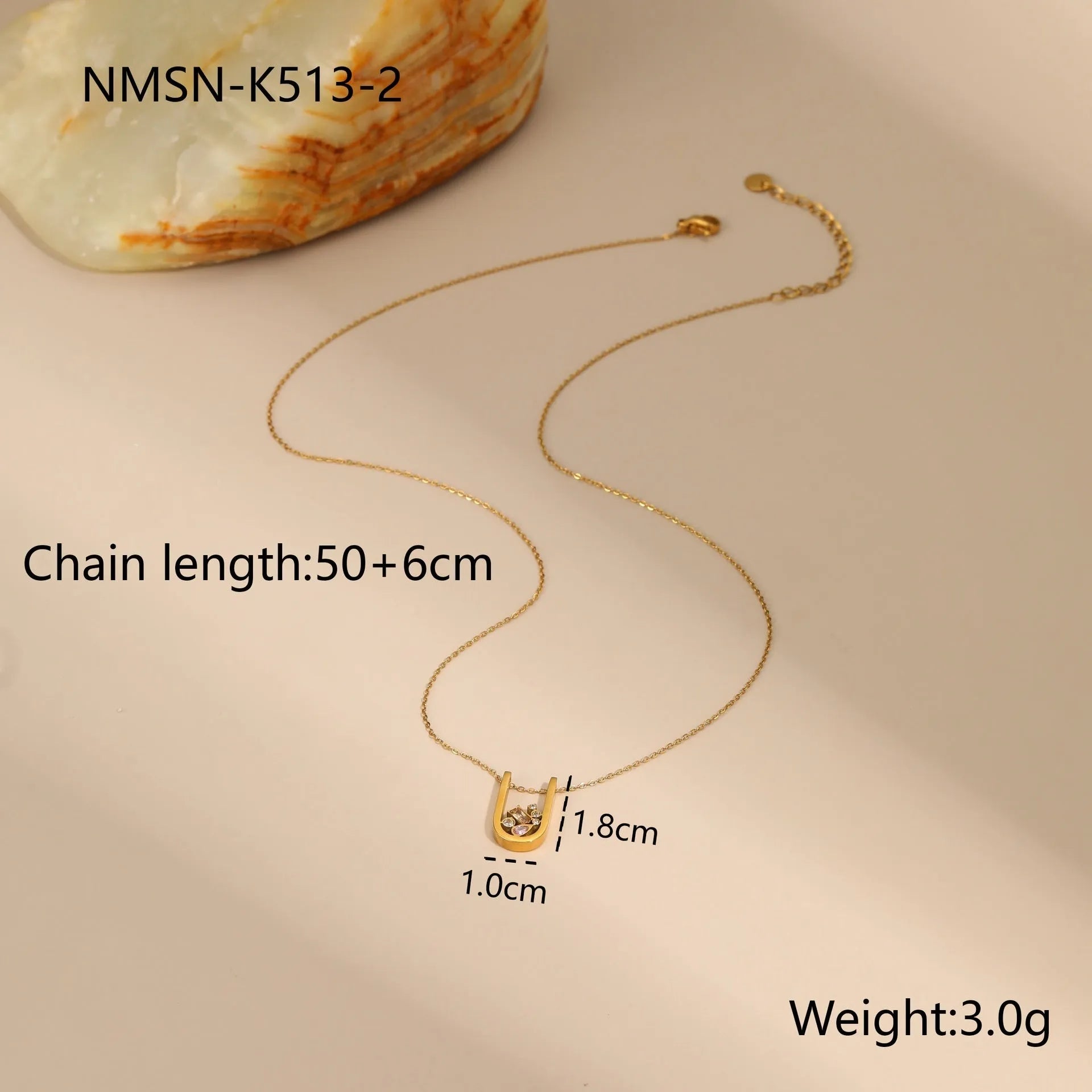 Gold plated geometric zircon jewellery set showing necklace, ring and earrings with stainless steel chain