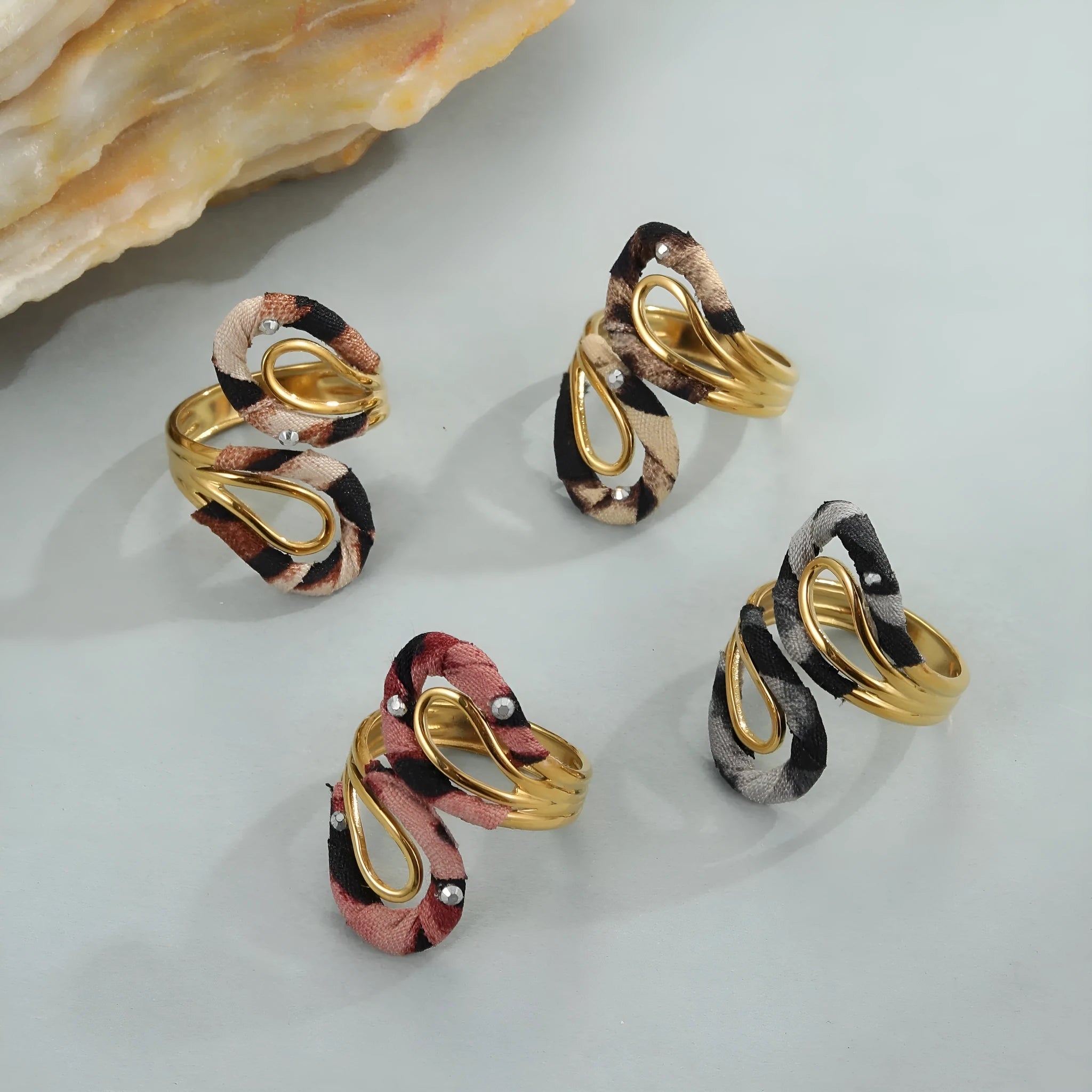 Stainless steel open mouth ring with leopard print and geometric designs including heart and star shapes