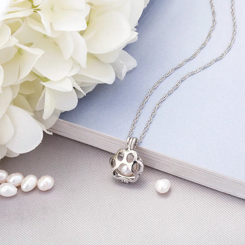 Hollow dog paw luminous alloy necklace with bamboo link chain and pendant, blue green colour option on white background