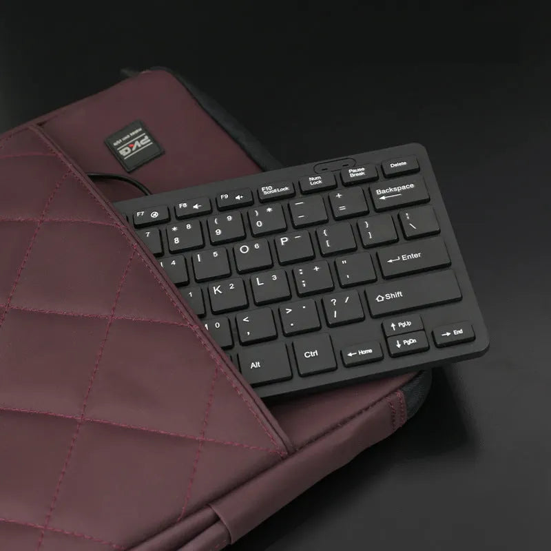 Compact wired USB keyboard in blue colour showing 280mm width and noiseless keys