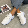 Women's mesh running shoes in creamy white with English muffin heel detail