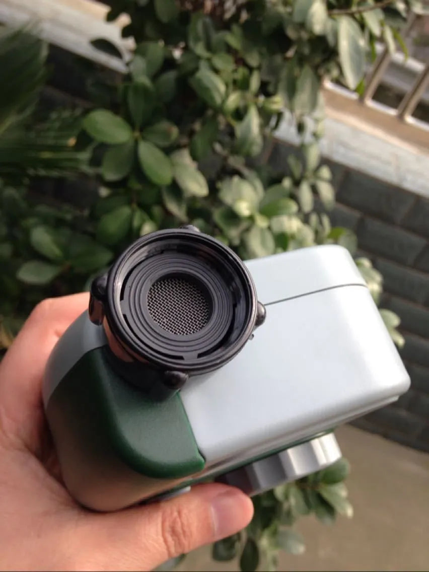 Green digital programmable garden hose faucet timer with copper connector and display