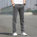 Men's straight leg jeans in smoky grey colour with a low waist and zipper fly