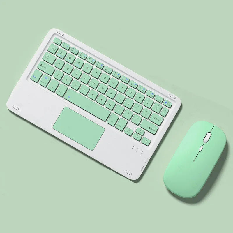 Pink wireless keyboard and mouse combo with slim touch keyboard and Bluetooth connectivity on wooden desk
