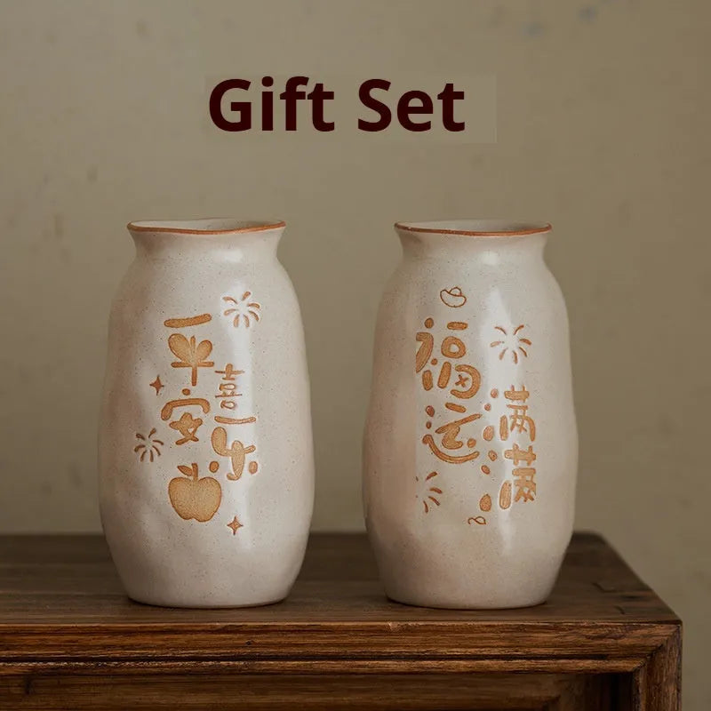 Chinese hand-painted ceramic vase with persimmon fruit designs on wooden desktop