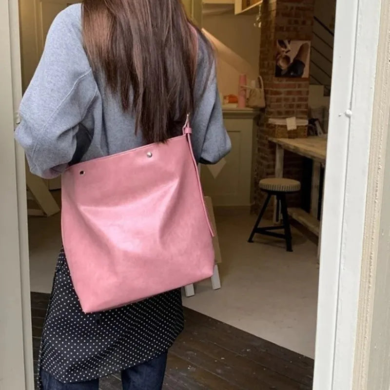 Corduroy one-shoulder commuter bag with PU lining in pink or brown, showing 39cm length dimensions