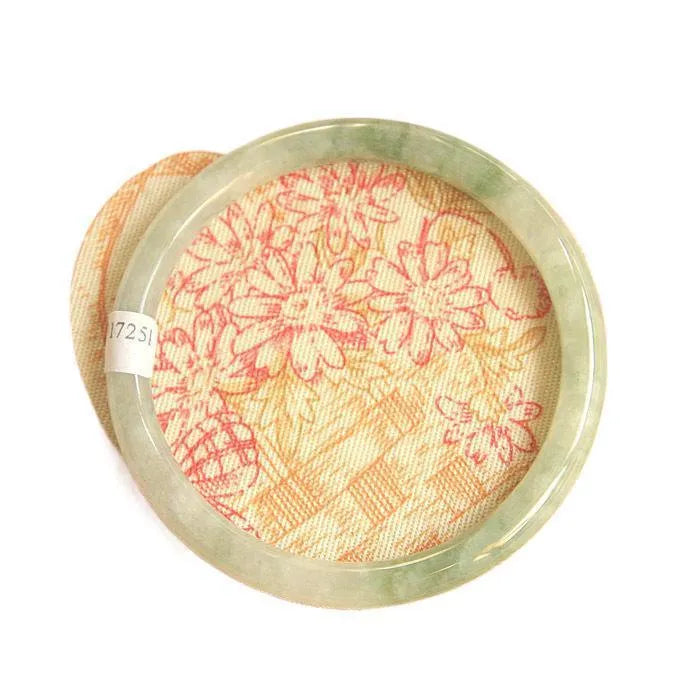 Green jade waxy geometric bracelet with unisex Chinese style design on a wrist.
