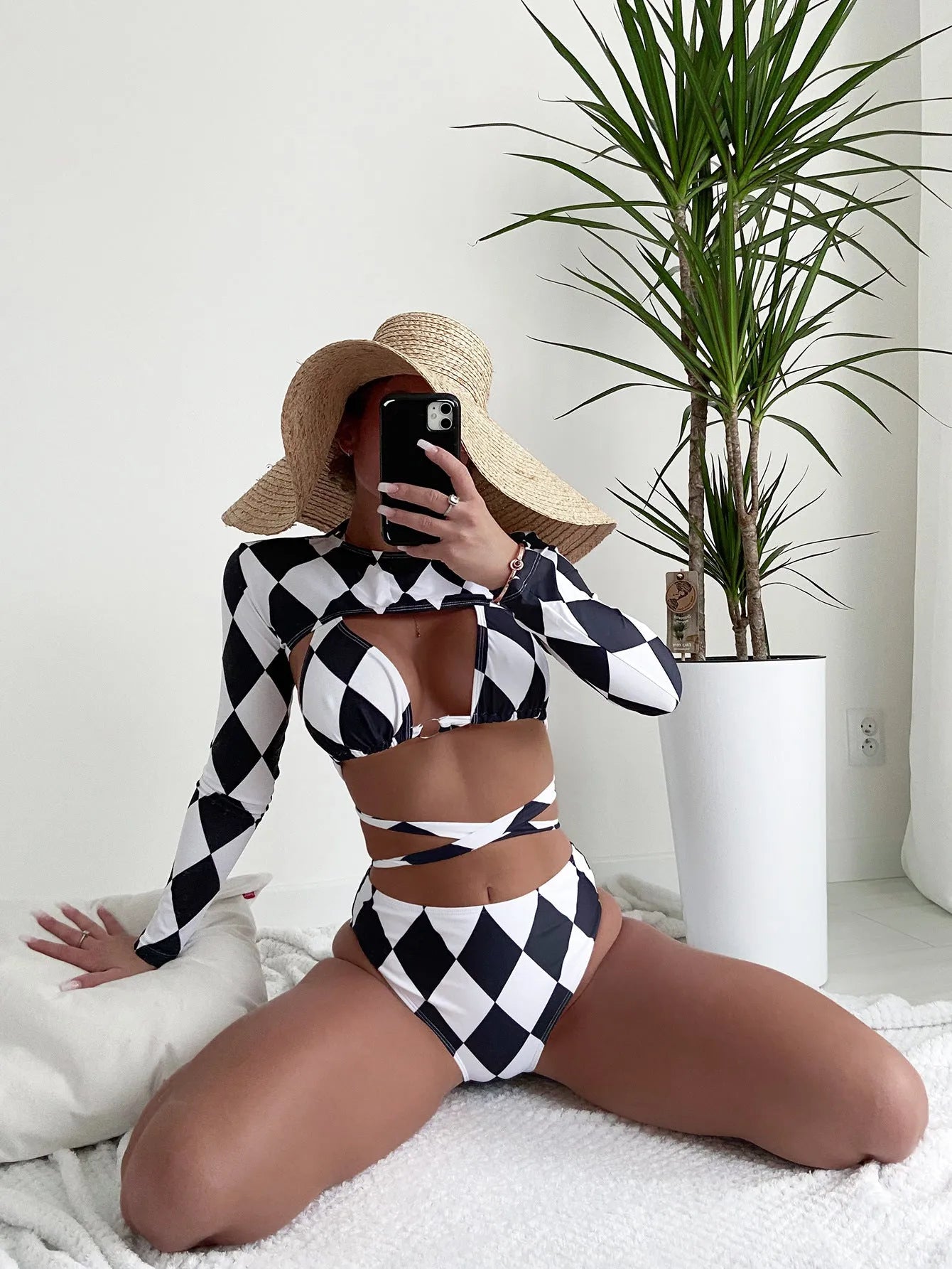 Women's long sleeve plaid bikini three-piece swimsuit set on mannequin