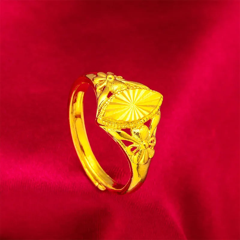 Alluvial gold tone open diamond flower ring with geometric design and textured surface