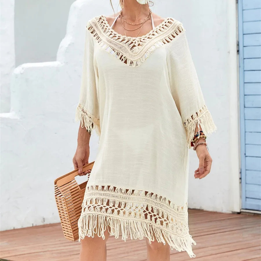 Apricot coloured women's crochet patchwork midi dress with half sleeves on a hanger.