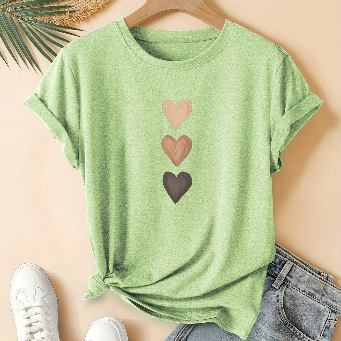 Women's art retro style printed cotton short sleeve T-shirt on a hanger.