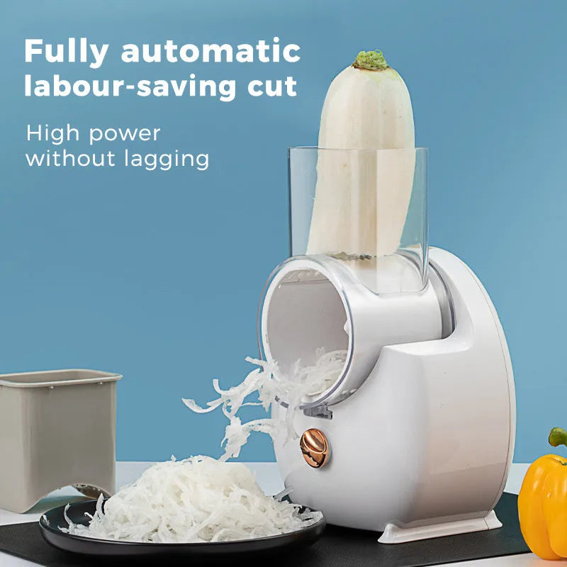 White electric vegetable slicer with rotary grater, three blades, and suction base on kitchen counter