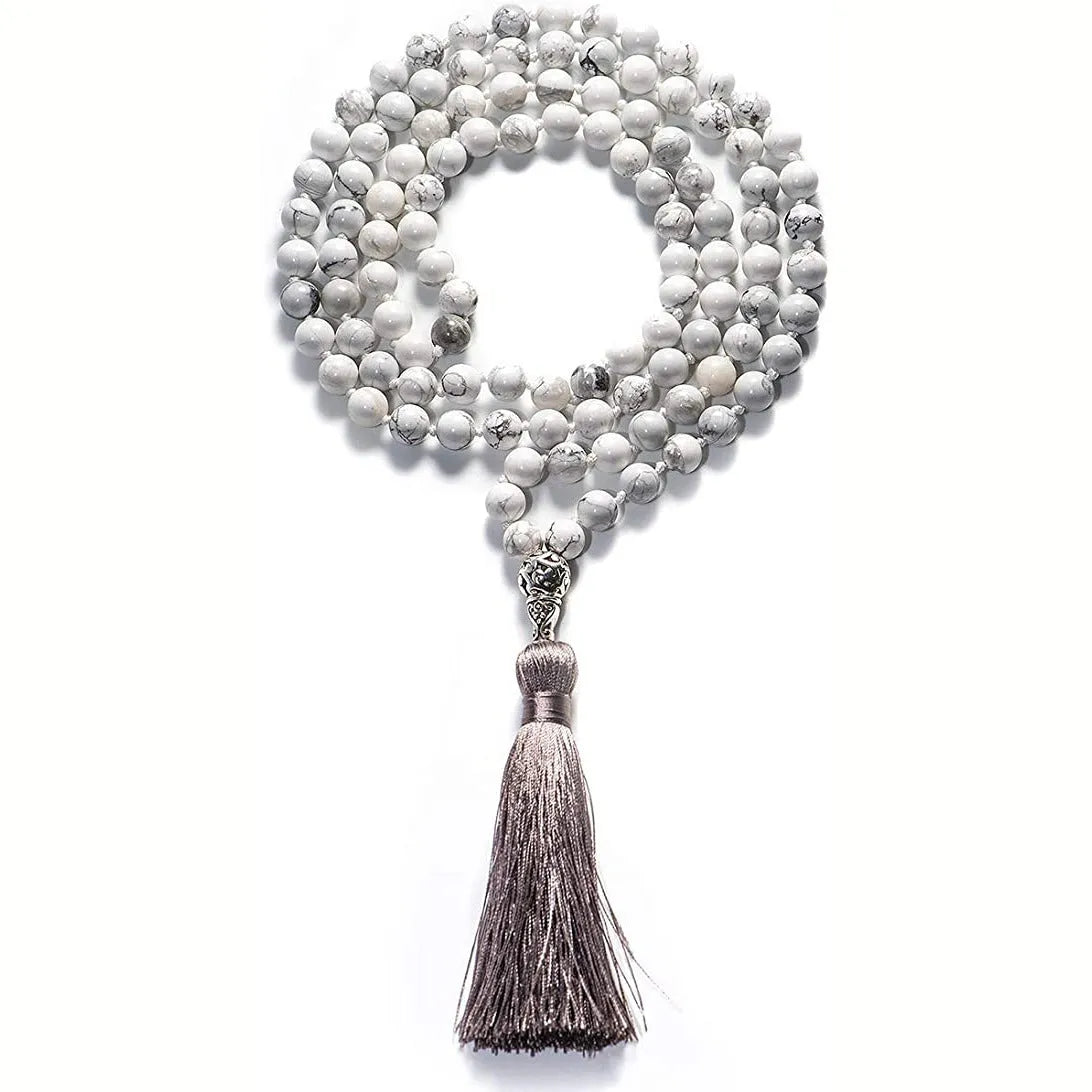Long multi-strand agate tassel necklace with geometric pattern of amethyst, lapis lazuli, and blue stone beads.