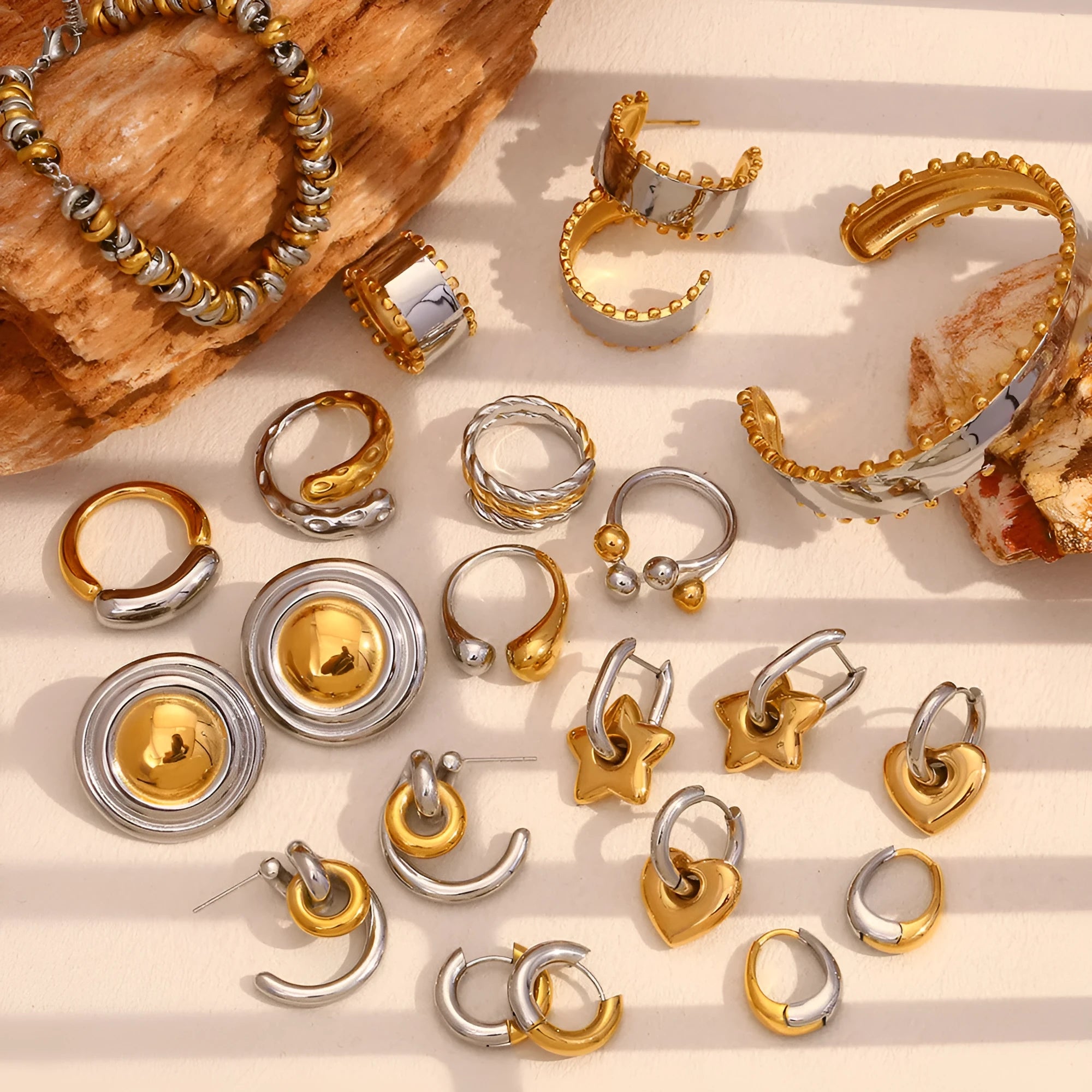 Women's geometric gold stainless steel jewellery set showing earrings, bracelet and necklace