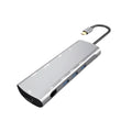 Grey aluminium USB-C docking station showing HDMI, VGA, USB 3.0, and power delivery ports